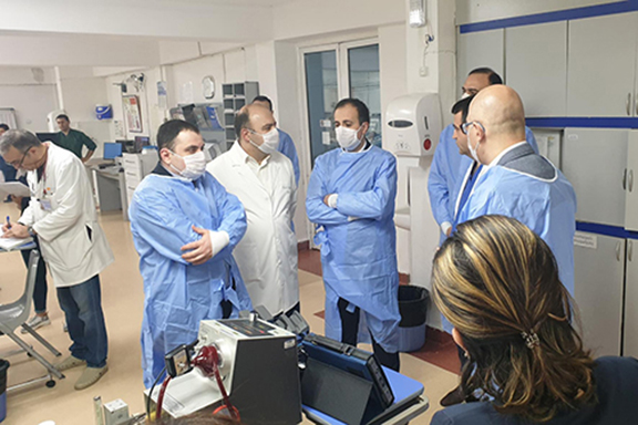 Armenia's Health Minister Arsen Torosyan (center) confers with healthcare professionals