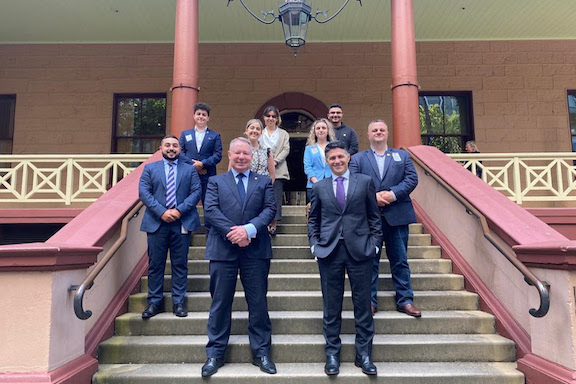 ANC Australia members and New South Wales lawmakers on the steps of the Legislative Assembly