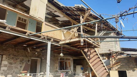 A damaged building from Azerbaijani shelling of Stepanakert