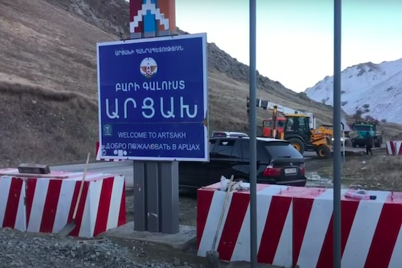 A sign welcoming visitors to Artsakh is the only remnant of Armenians left in Karvachar along the Vardenis-Martakert highway