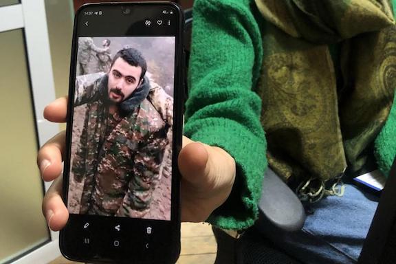 Erica Khachaturyan shows Human Rights Watch an image of her nephew Eric Khachaturyan, a prisoner of war (POW) in Azerbaijan, taken from a video in which he and other POWs are abused. Yerevan, November 2020