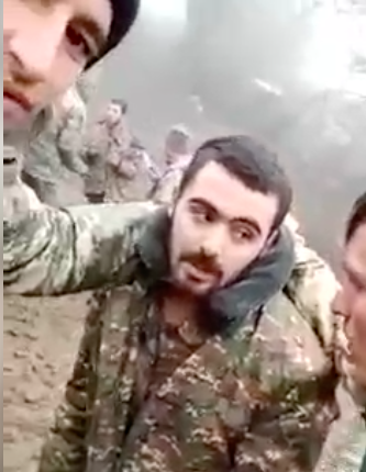 An Armenian POW is paraded on social media and beaten